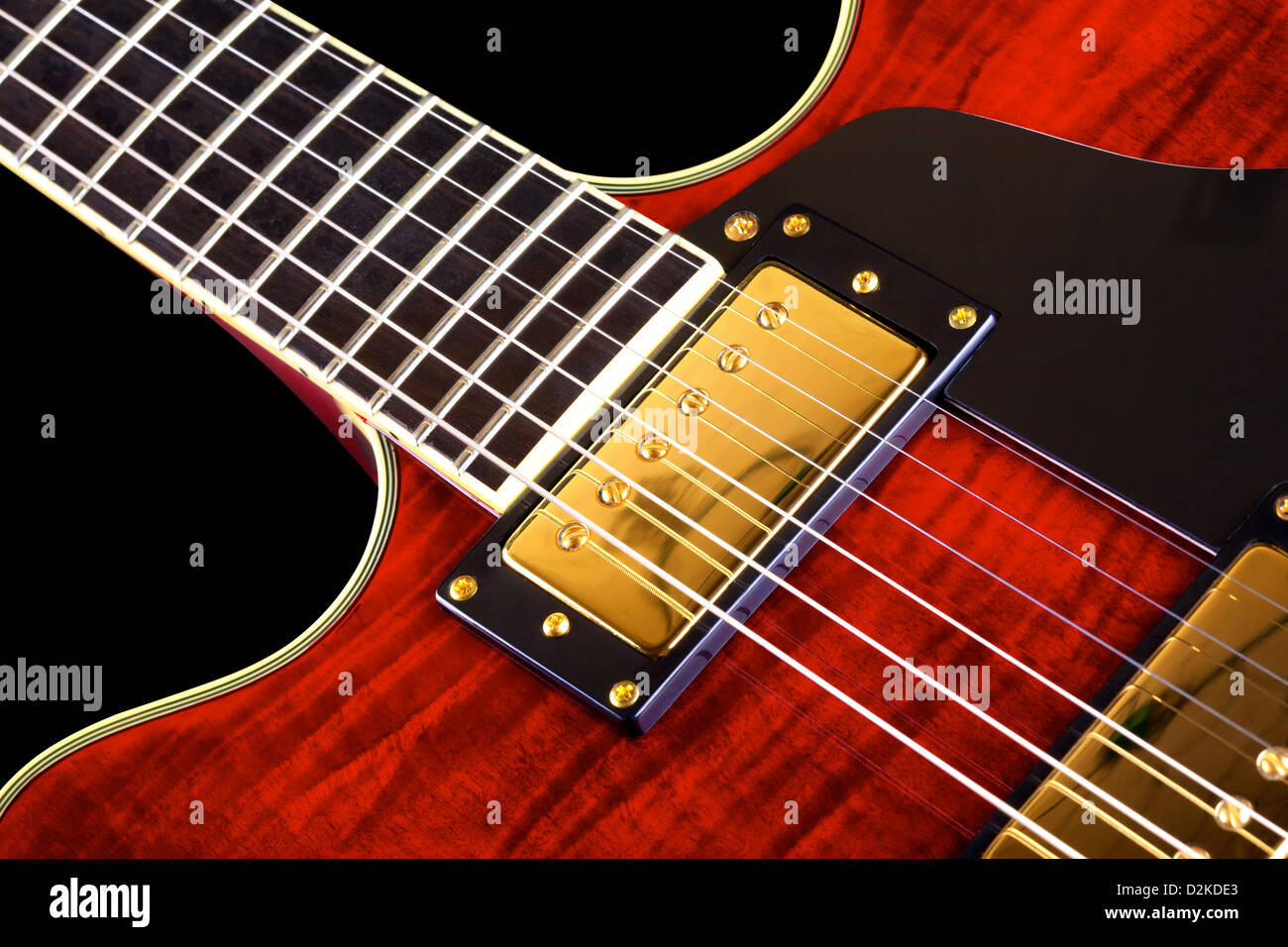 red electric guitar isolated on black background, closeup Stock Photo