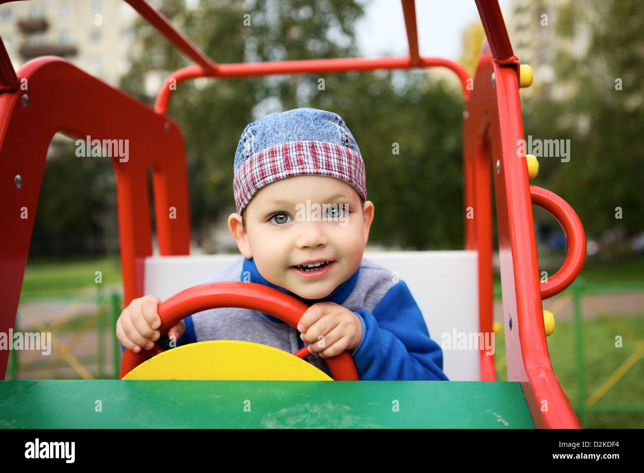 little boy playing on playground in toy car Stock Photo - Alamy