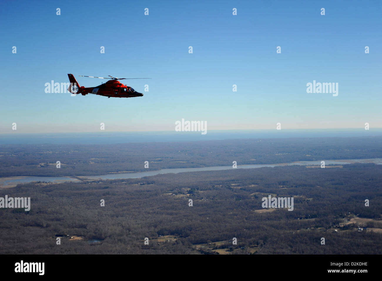A Coast Guard MH-65 Dolphin helicopter aircrew from Coast Guard Air Defense Facility Washington, D.C., conducts training exercises over southern Maryland within the National Capitol Region, January 19, 2013. Coast Guard aircrews from Coast Guard Air Defen Stock Photo