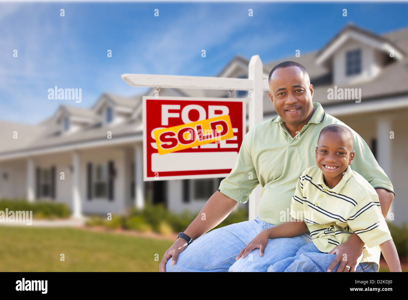 African American Father and Son In Front of Sold For Sale Real Estate ...