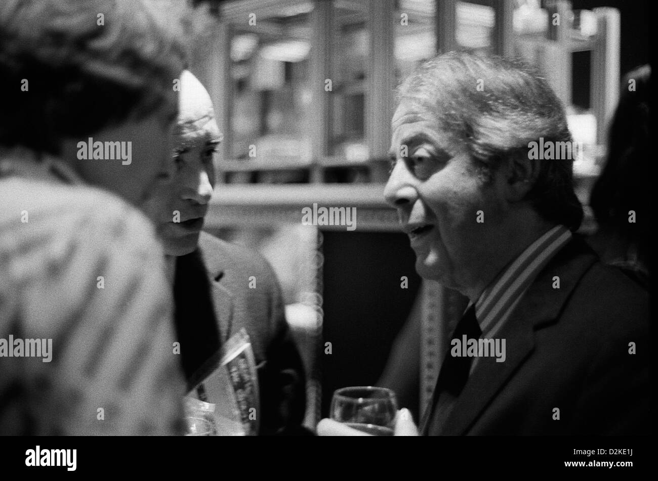 British architect Sir Denys Lasdun in conversation at the RIBA Heinz Gallery Portman Place London England UK 1975 KATHY DEWITT Stock Photo