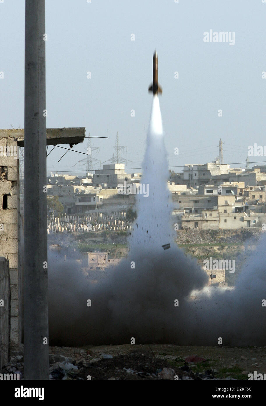 Aleppo, Syria. 27th Jan, 2013. Members of the Free Syrian Army (FSA) launch a self-build rocket after taking control of the area and trying to defence against a counter-attack in a southern area of Aleppo, Syria, 27 January 2013. The southern region of Aleppo is of strategic importance, because the last connection between the airport and the west part of the city runs through the area. Both regions are still controlled by Assad's government troops while the rest of the area is under control of the FSA.   Photo: THOMAS RASSLOFF Stock Photo