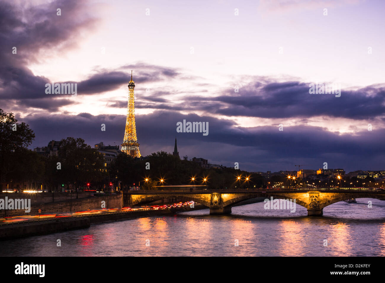 Night view on Eiffel tower from Alexander III bridge in Paris Stock Photo