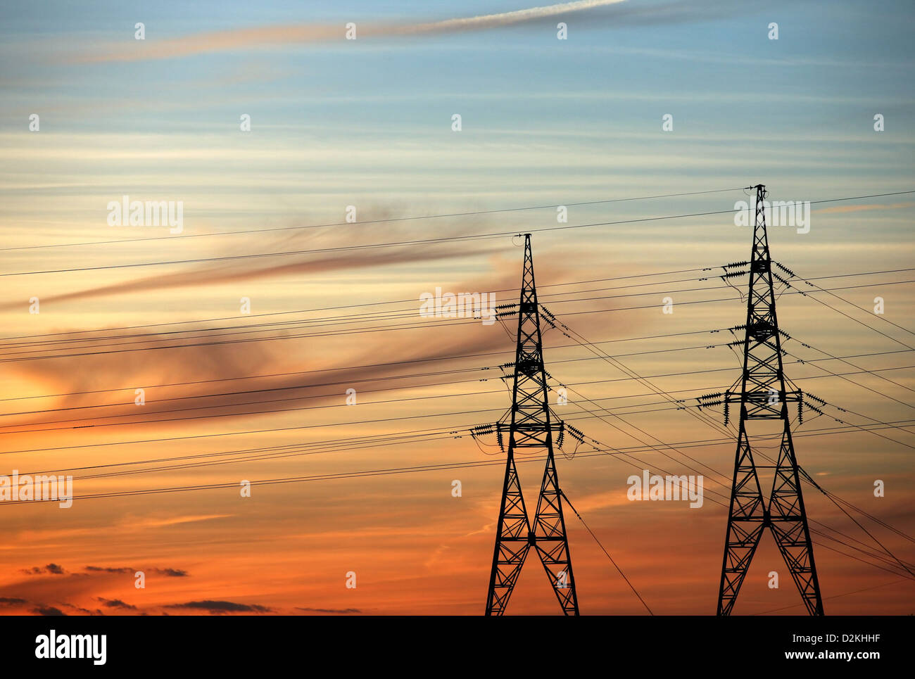 High voltage tower on a background of the red sky Stock Photo - Alamy