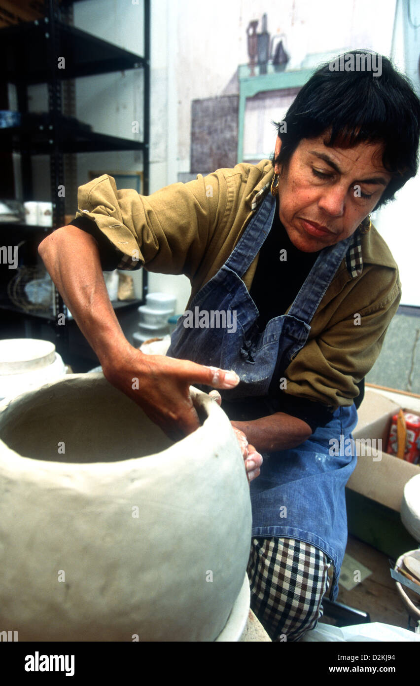 52 year old blind & diabetic female artist/sculpture at work in her