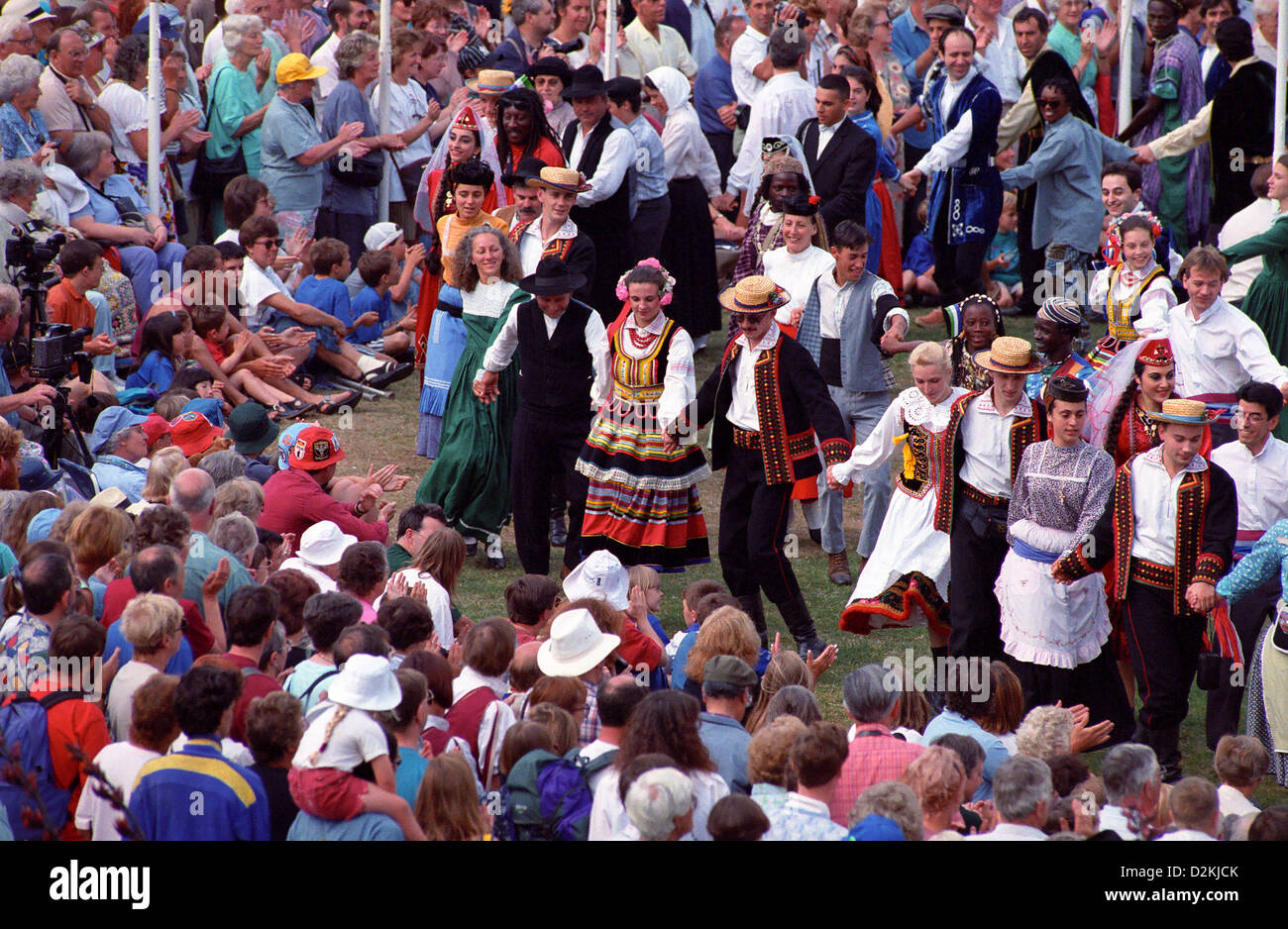 Dancers parade in front of the crowd at Sidmouth Folk Festival