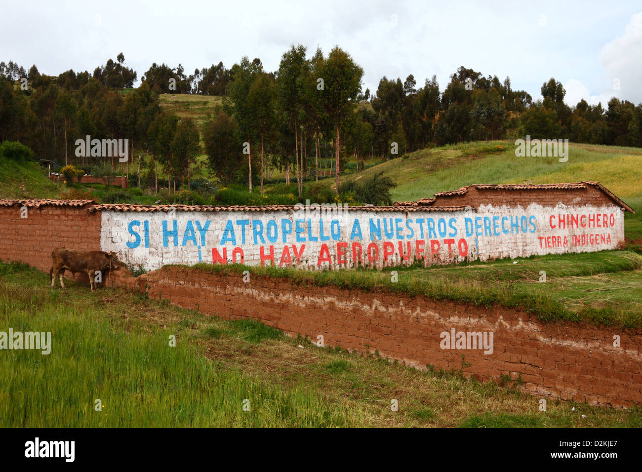 Writing on farm wall protesting against plans to build an international airport near village of Chinchero , near Cusco , Peru Stock Photo
