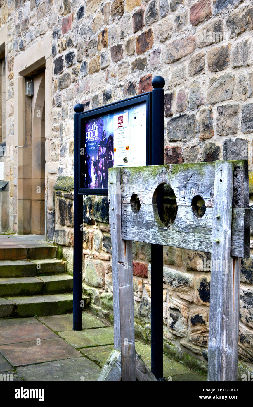 Stocks & entrance to Hexham Old Gaol(1330-33), oldest purpose built prison in England, now a museum, Hexham, Northumberland, UK Stock Photo