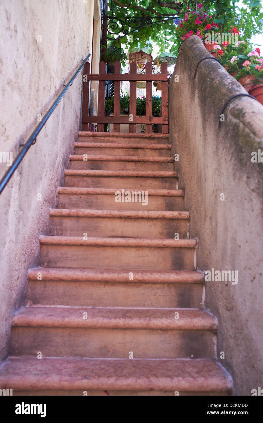 Steps with bird cages at top, Malcesine Lake Garda Italy Stock Photo