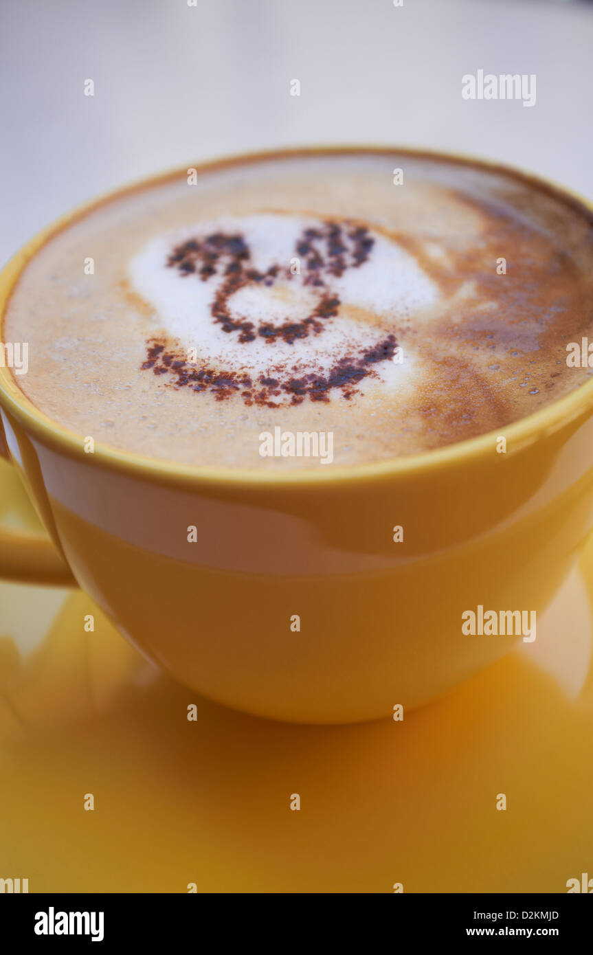 Cup of coffee with smiley face made of cocoa Stock Photo