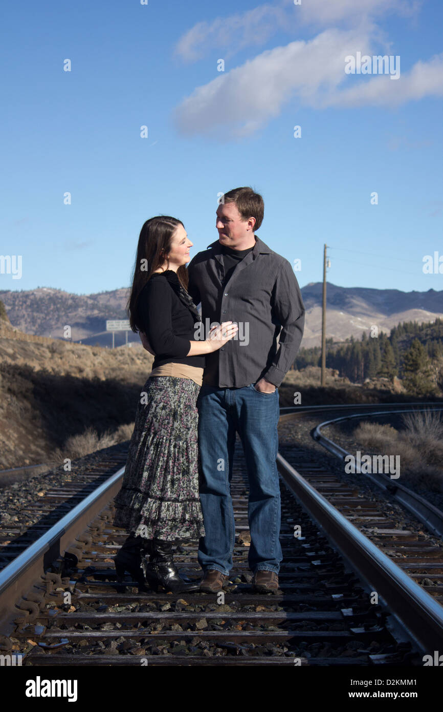 Couple walking on train tracks hi-res stock photography and images - Alamy