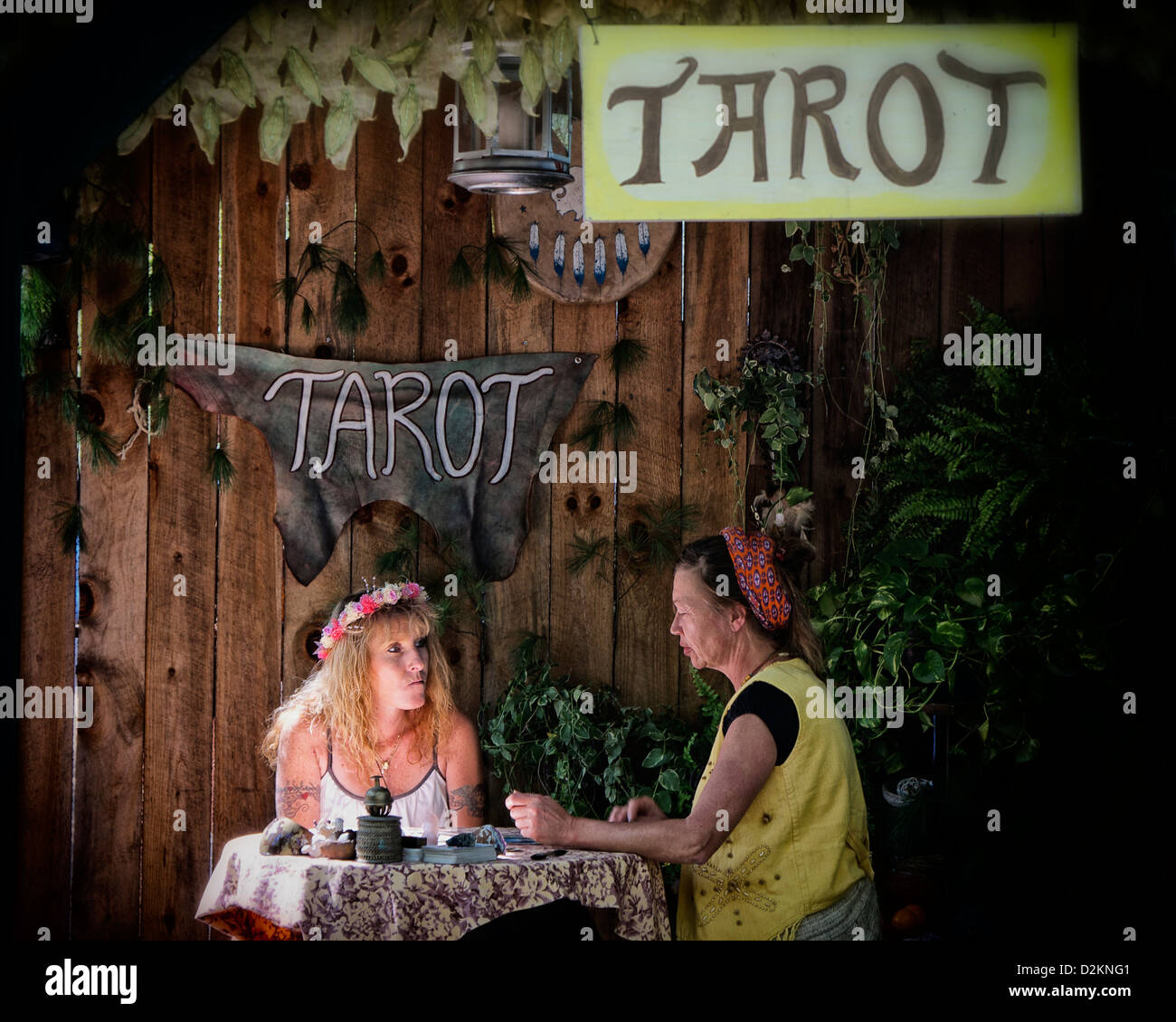 Woman sitting for Tarot reading with a concerned look on her face Stock Photo