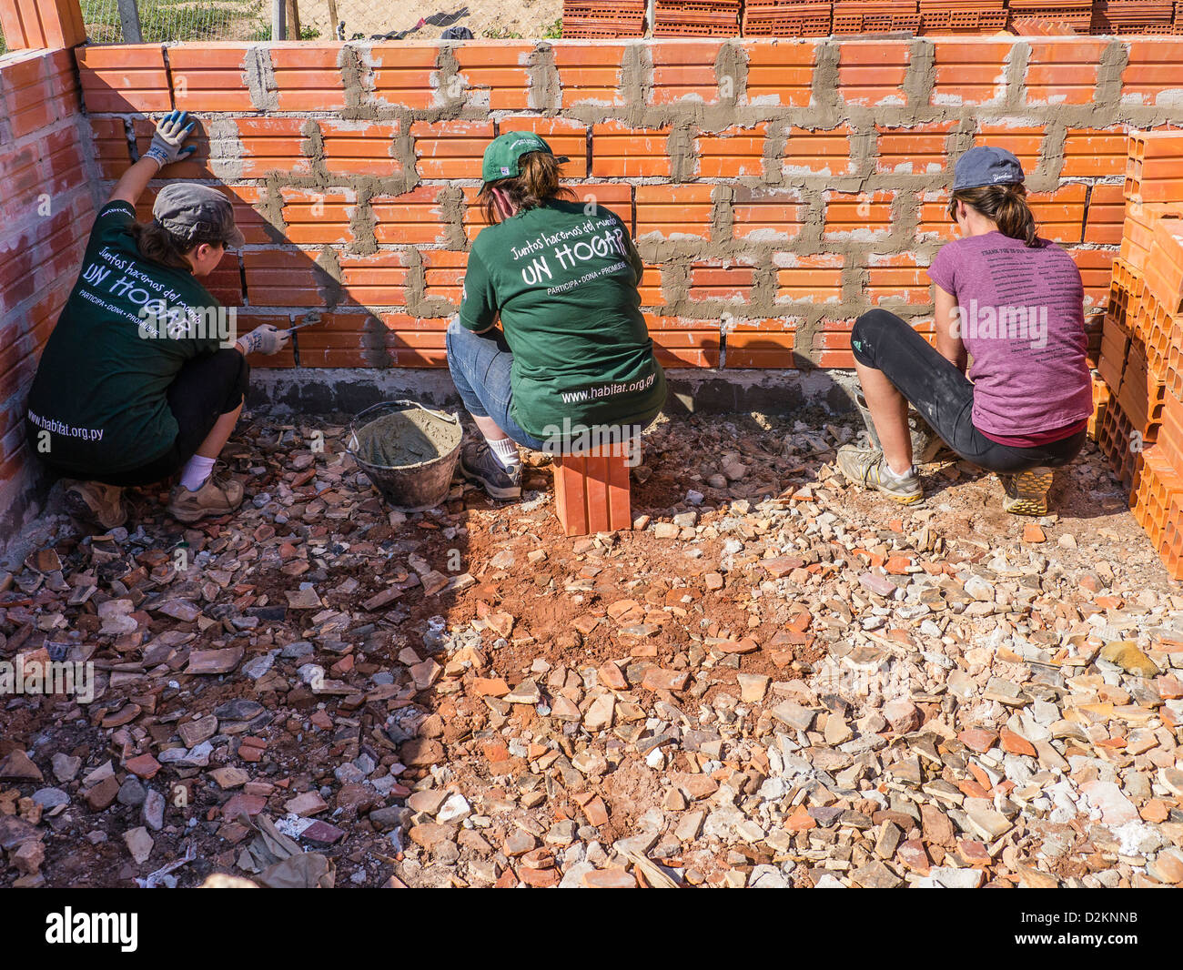 A group of female international volunteers work on a Habitat for Humanity house building site in Luque, Paraguay. Stock Photo