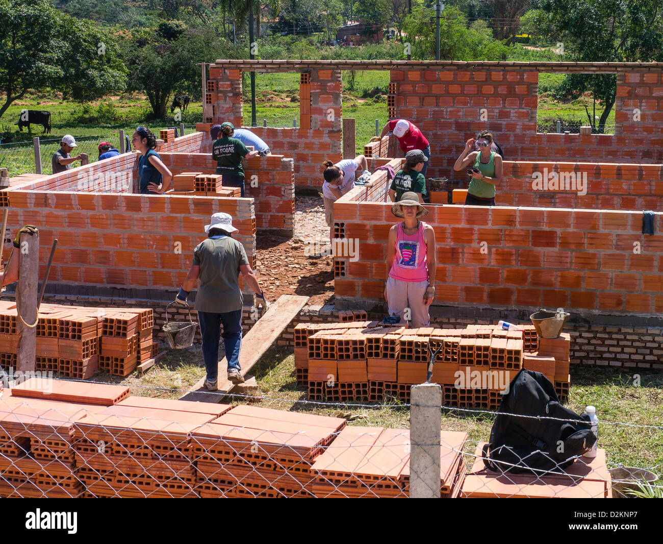 A group of international volunteers work on a Habitat for Humanity house building site in Luque, Paraguay. Stock Photo