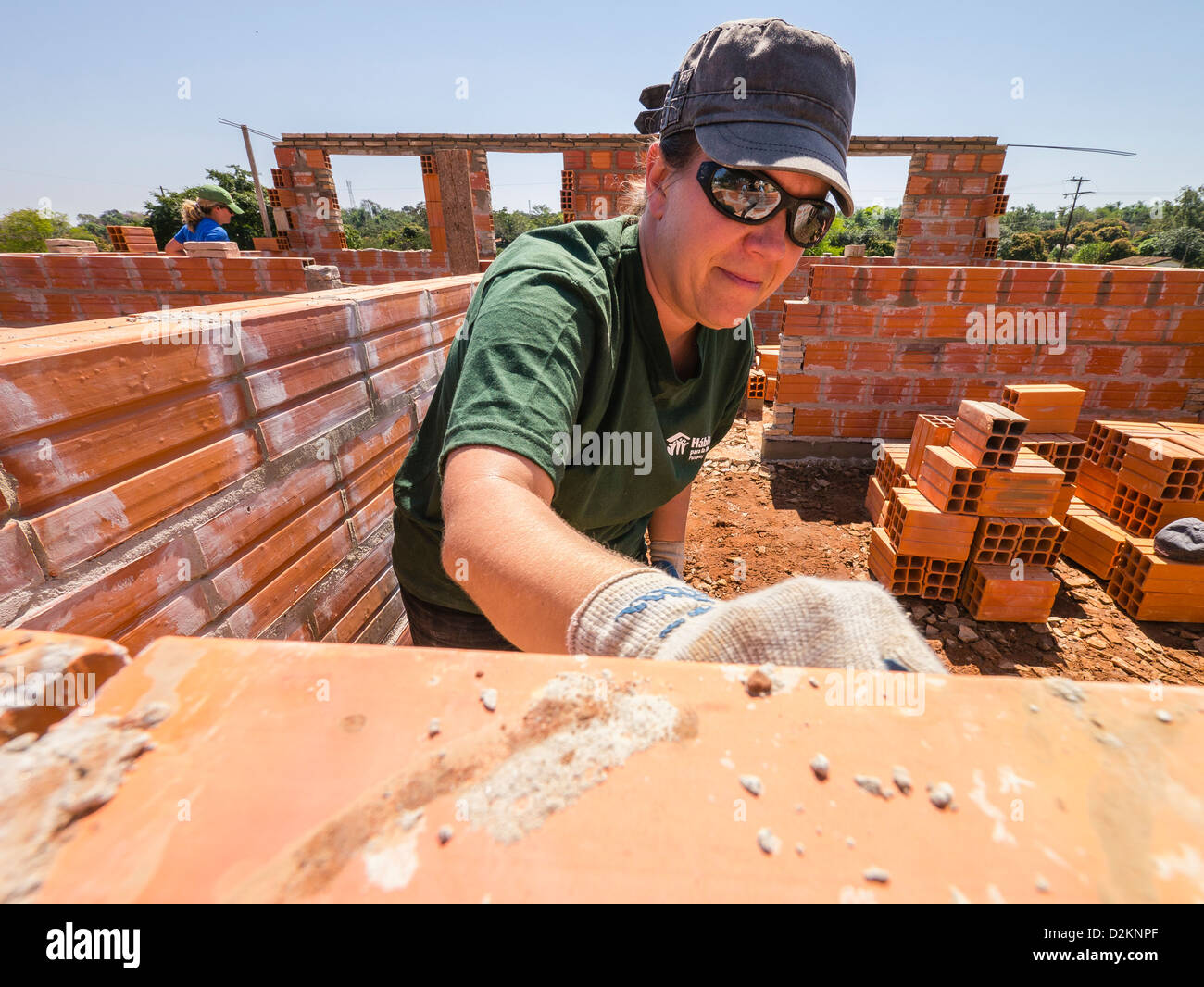 A volunteer from the United States works on a Habitat for Humanity site in Luque, Paraguay. Stock Photo