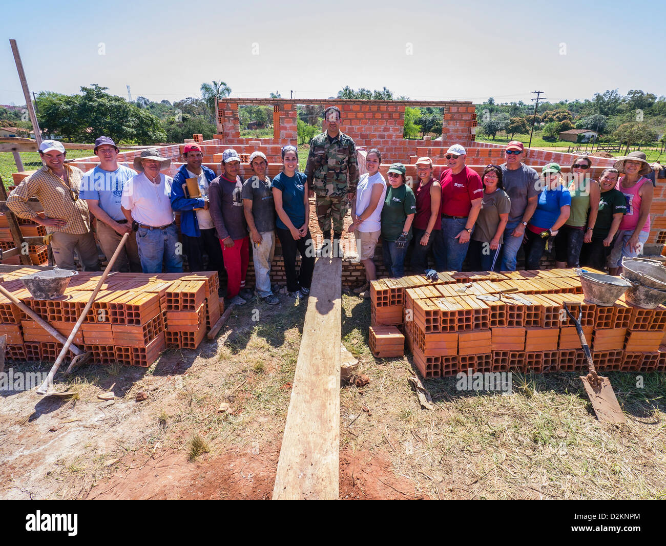 A group of international volunteers on a Habitat for Humanity site in Luque, Paraguay. Stock Photo