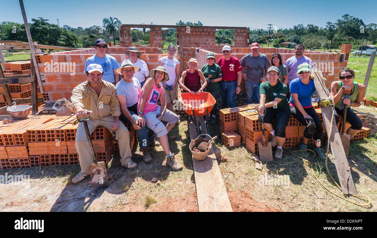 A group of international volunteers on a Habitat for Humanity site in Luque, Paraguay. Stock Photo
