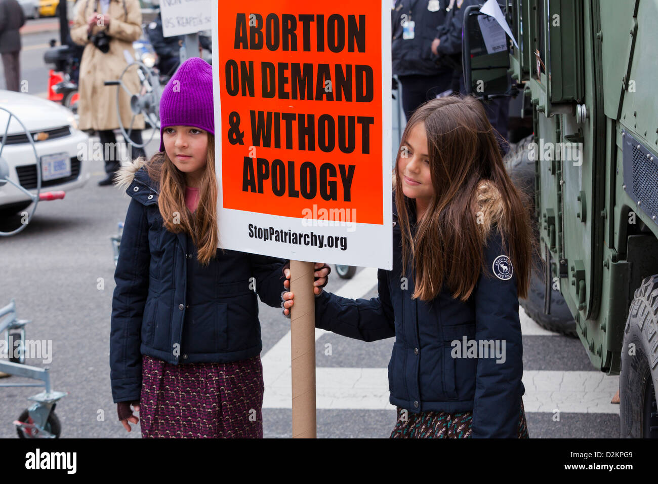 Young girls holding pro abortion message placard at a demonstration Stock Photo
