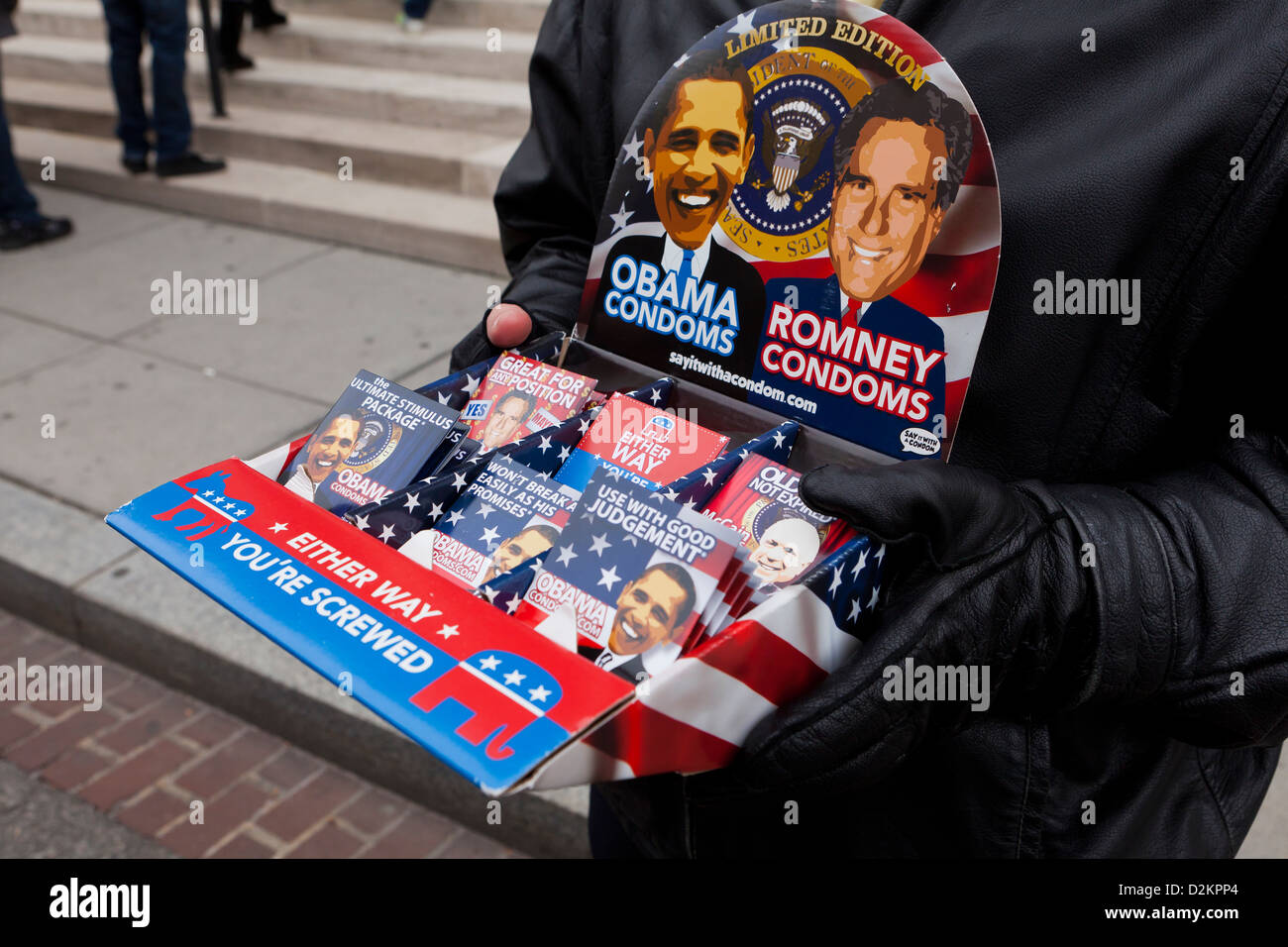 Man selling Obama Romney theme condoms Stock Photo