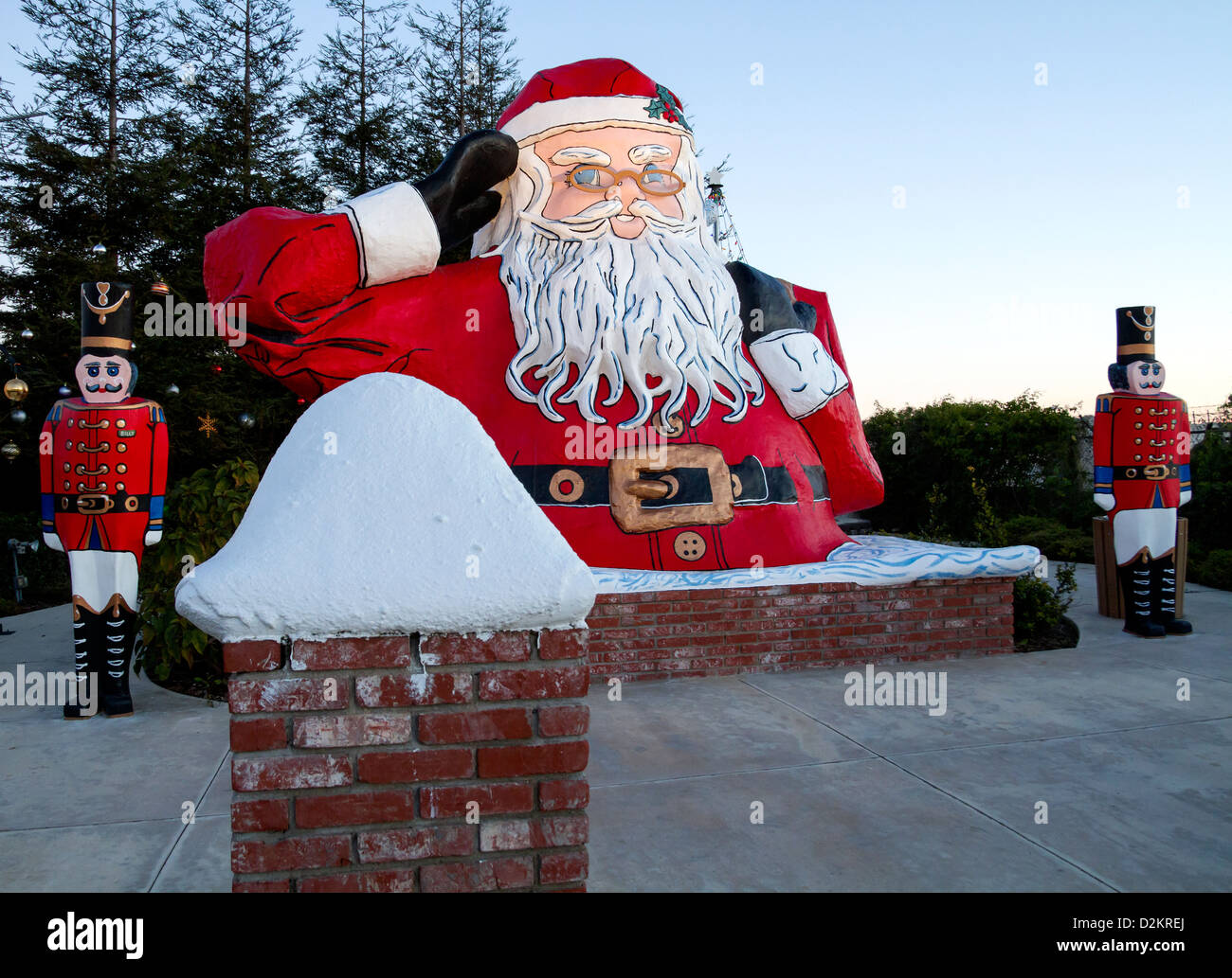 Santa Claus going down a chimney Stock Photo