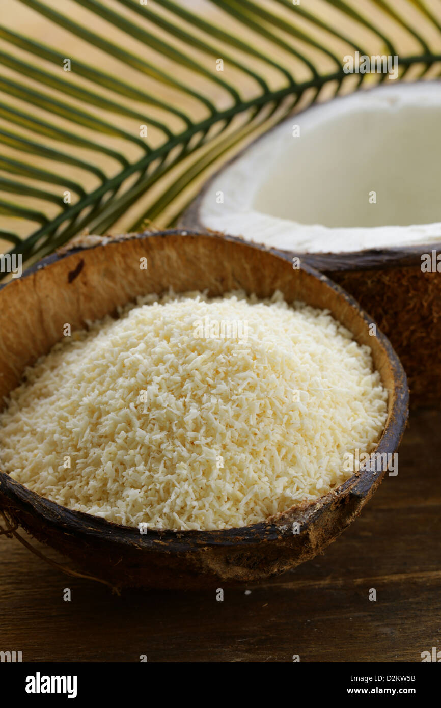 grounded coconut flakes  and fresh coconut Stock Photo