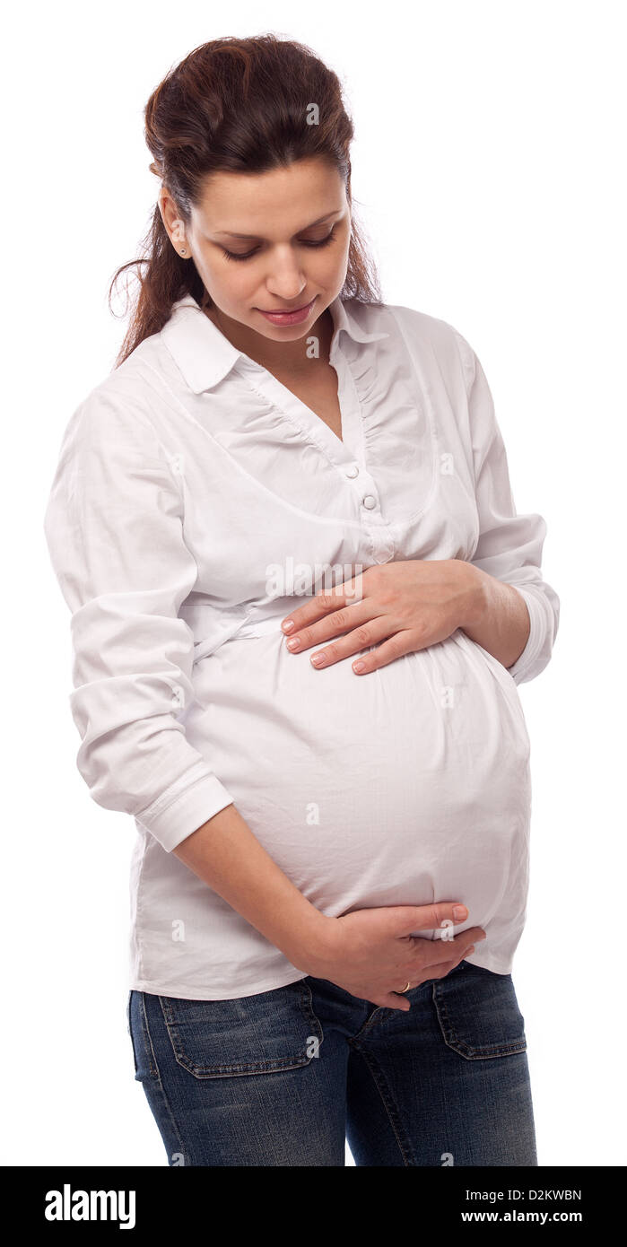 Happy pregnant woman keeping hands on her belly Stock Photo - Alamy