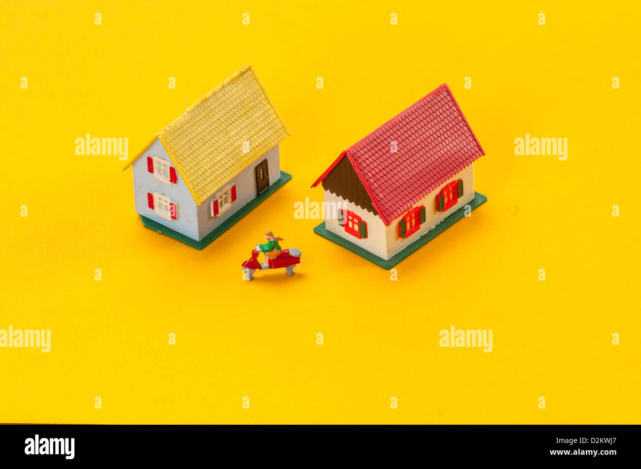 Two miniature houses with motorcycle Stock Photo