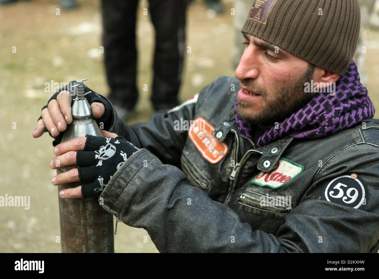 Aleppo, Syria. 27th January 2013. A member of the Free Syrian Army (FSA) prepares to launch a self-build rocket after taking control of the area and trying to defence against a counter-attack in a southern area of Aleppo, Syria, 27 January 2013. The southern region of Aleppo is of strategic importance, because the last connection between the airport and the west part of the city runs through the area. Both regions are still controlled by Assad's government troops while the rest of the area is under control of the FSA.   Photo: THOMAS RASSLOFF/ Alamy Live News Stock Photo