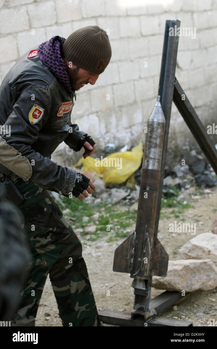 Aleppo, Syria. 27th January 2013. A member of the Free Syrian Army (FSA) prepares to launch a self-build rocket after taking control of the area and trying to defence against a counter-attack in a southern area of Aleppo, Syria, 27 January 2013. The southern region of Aleppo is of strategic importance, because the last connection between the airport and the west part of the city runs through the area. Both regions are still controlled by Assad's government troops while the rest of the area is under control of the FSA.   Photo: THOMAS RASSLOFF/ Alamy Live News Stock Photo