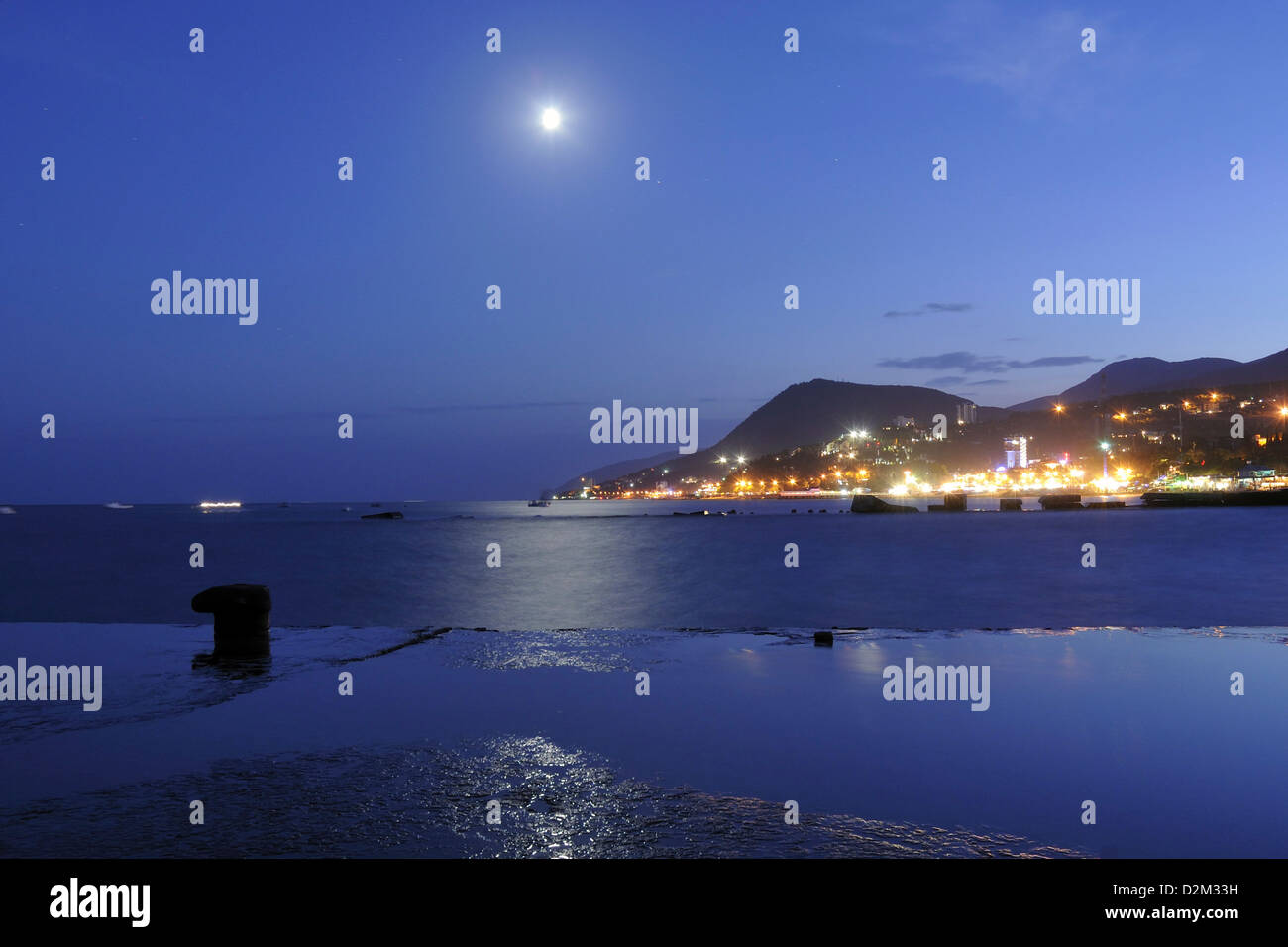 moon rising over Black sea in place of Alushta city in Crimea, Ukraine Stock Photo