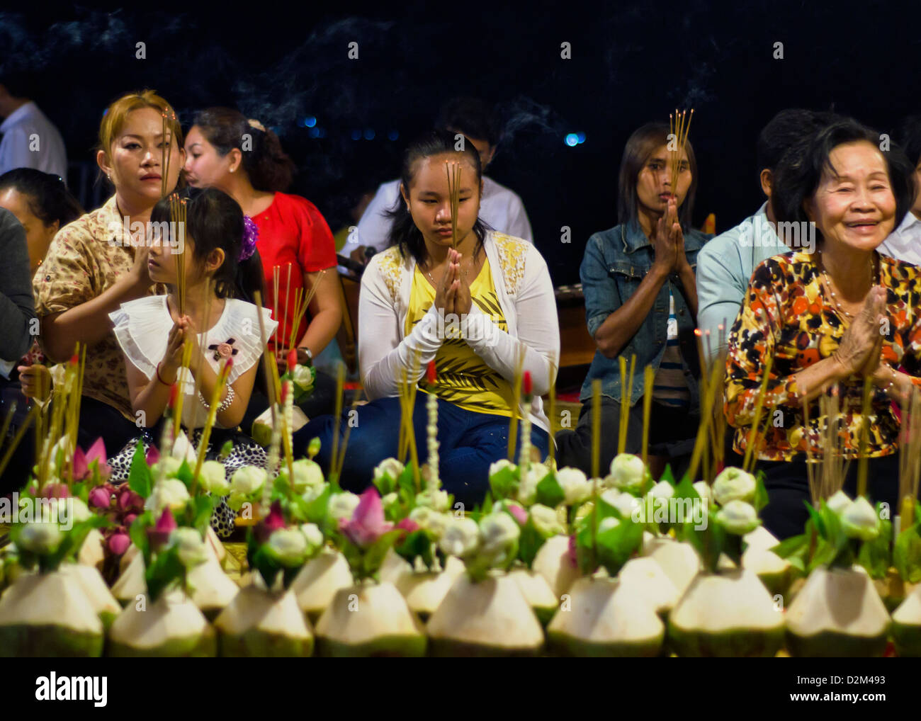 Women pray at Dorngkeur Buddhist shrine at Phnom Penh,Cambodia Stock Photo