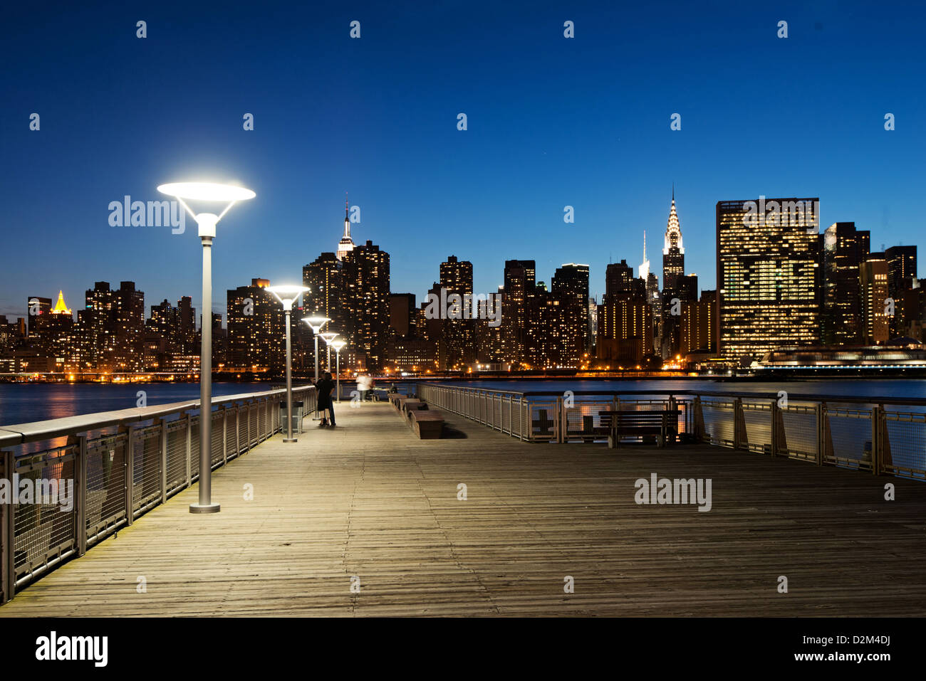 NYC Skyline from Gantry Plaza State Park Promenade at Night Stock Photo