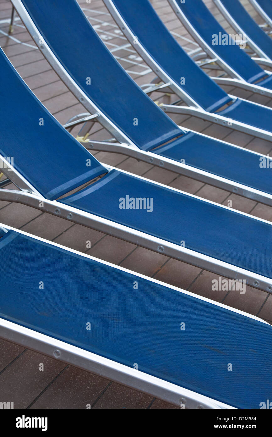 symmetry  in blue sun beds in a cruise Stock Photo