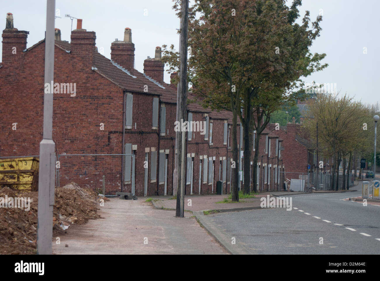 A row of former colliery homes boarded up and ready for demolition at Pleasley, Mansfield, North Nottinghamshire. Stock Photo