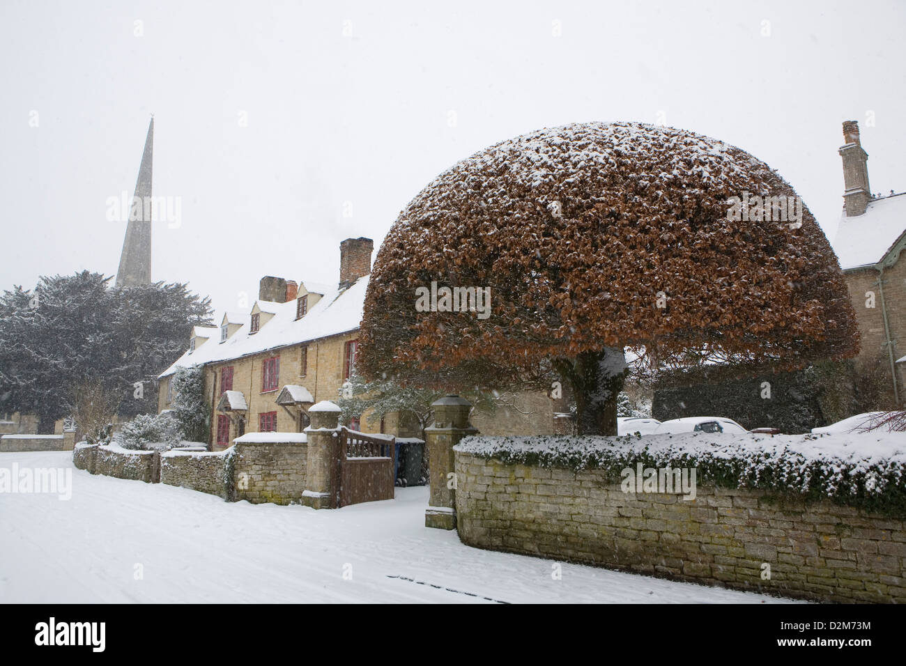 Church Street Kidlington, Oxfordshire mid winter, it is snowing, snow