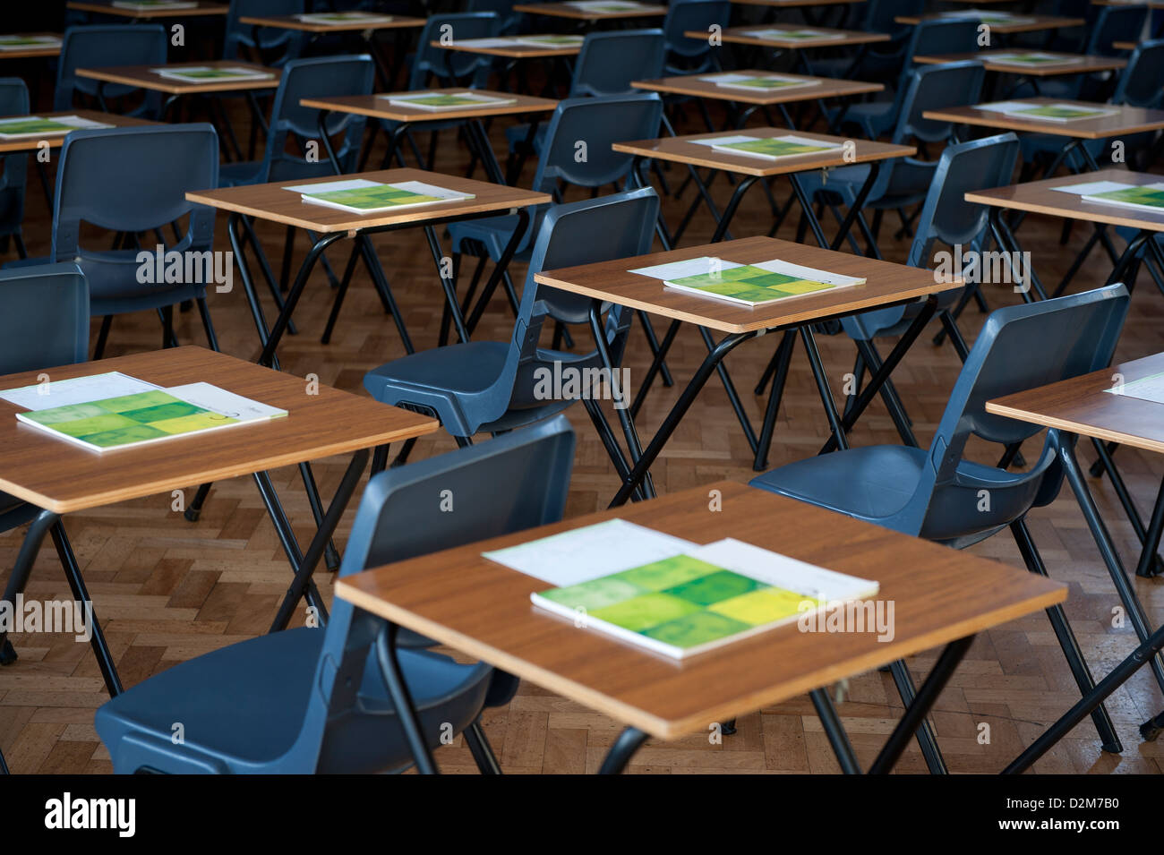 Desks and tables set out for exams in a UK university school gymnasium