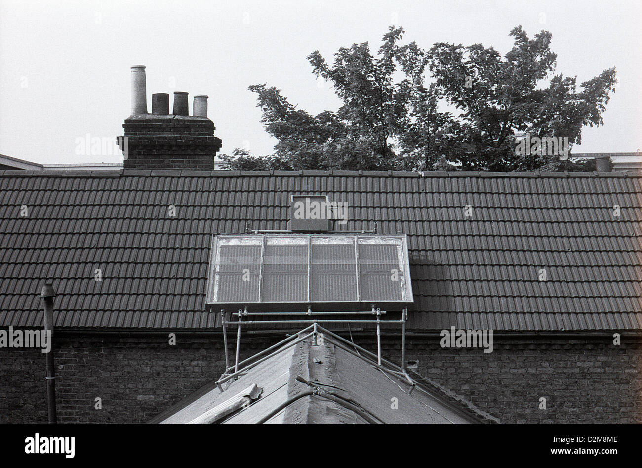 Solar panel panels on the roof of a commune communal squatted house squat property in 1974 Camberwell South London  England UK   KATHY DEWITT Stock Photo