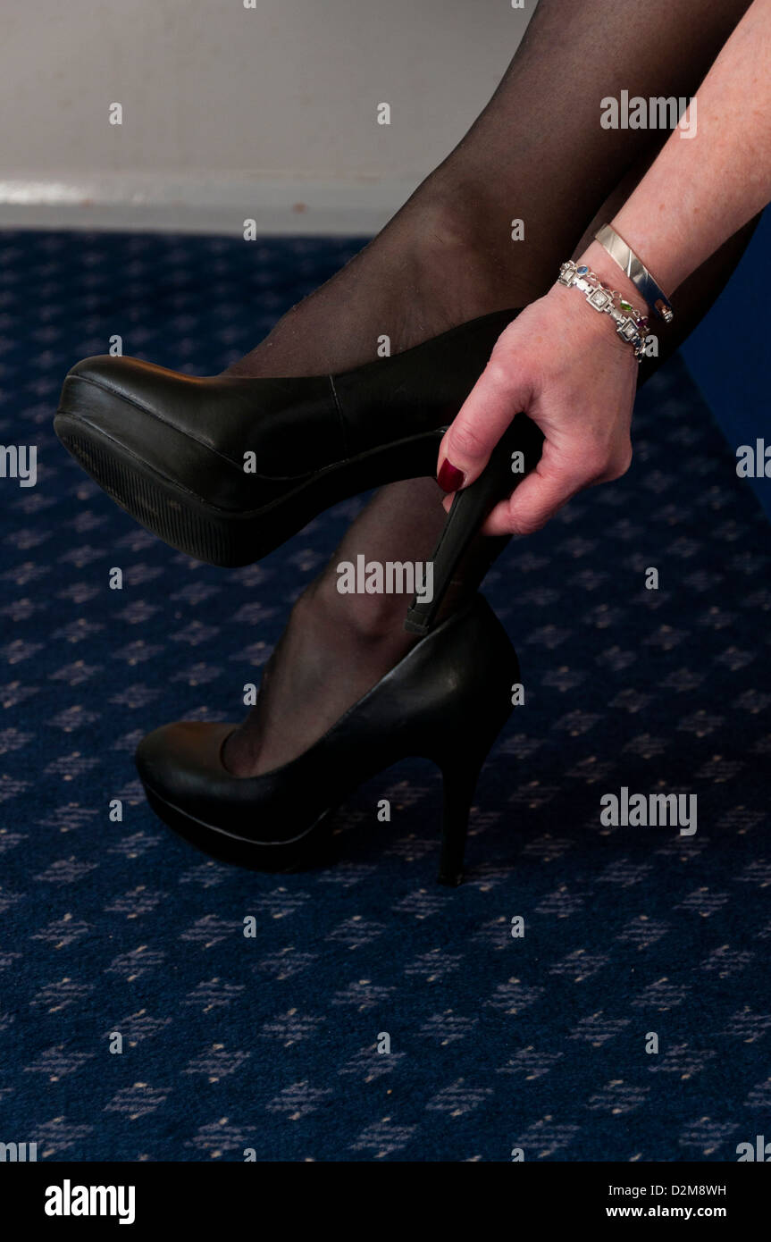 Older woman black high heel stilletto shoes Stock Photo - Alamy