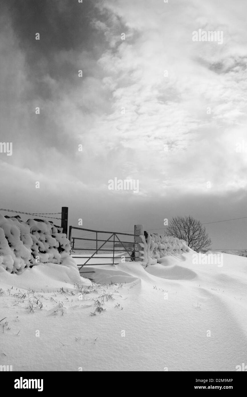 Snow drifts at a gate Stock Photo - Alamy