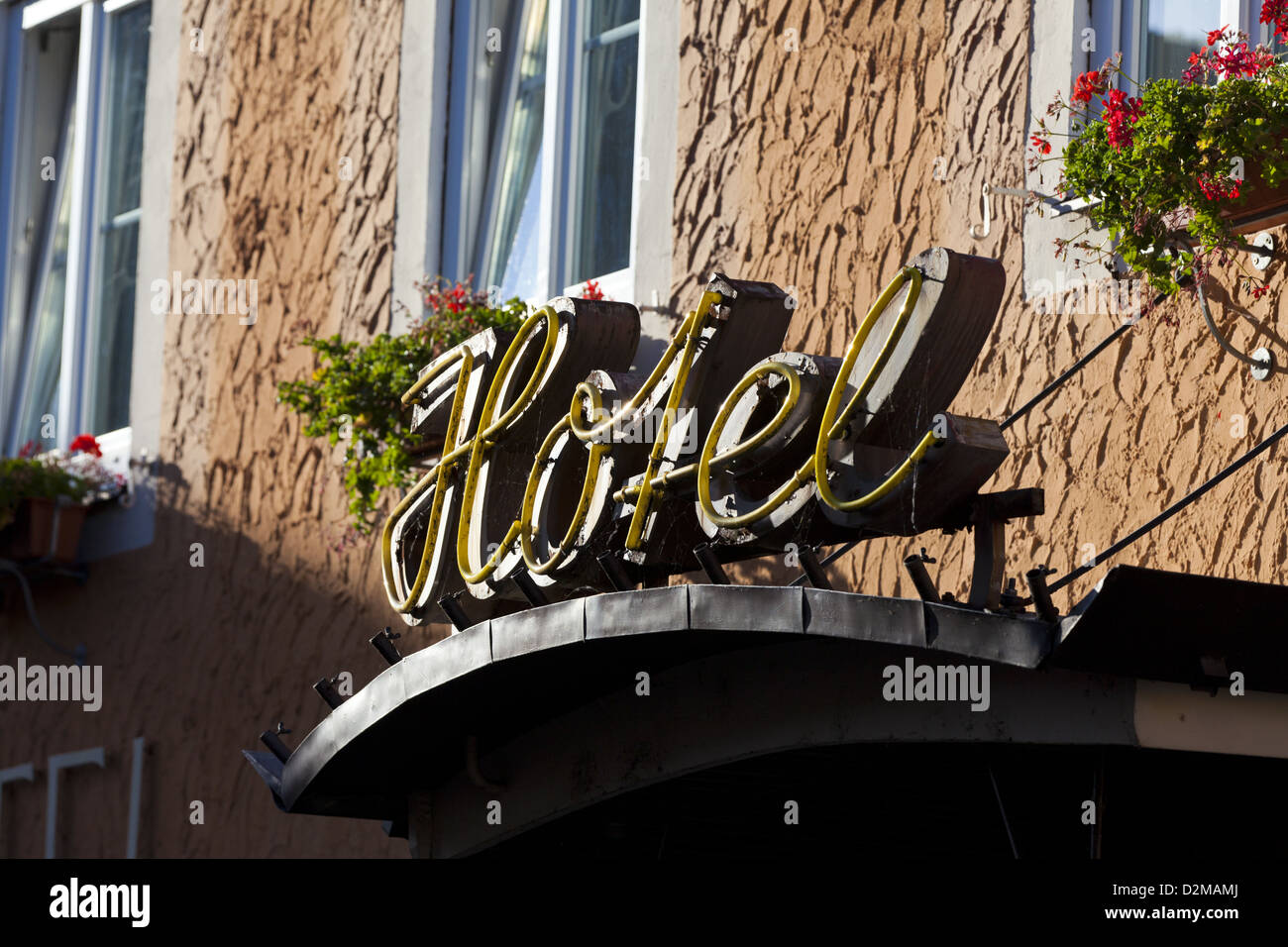 Yellow Neon sign for a Hotel Stock Photo