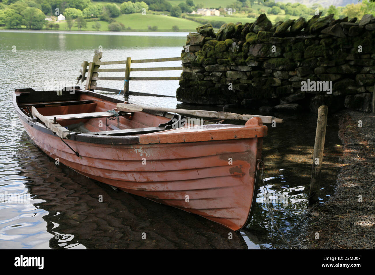 Dilapidated fishing skiff beached at Loweswater in the English lakes Stock Photo