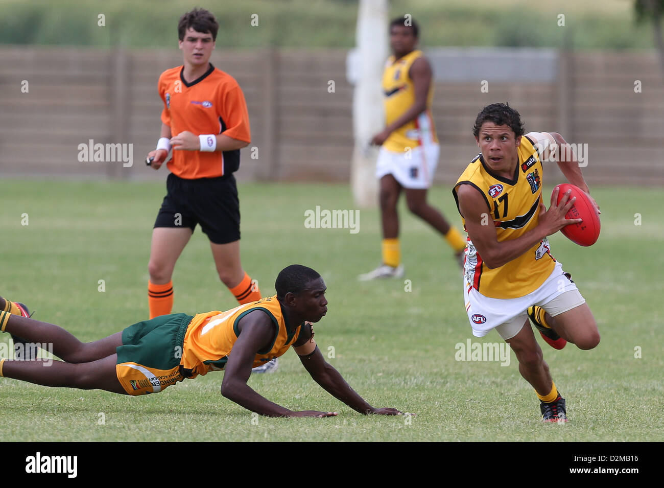 POTCHEFSTROOM, SOUTH AFRICA - JANUARY 28, Cory Glass (Chirnside Park, VIC) of the Australian Boomerangs evades a tackle during the AFL Game 1 match between the Flying Boomerangs and South African Lions under 18's at Mohadin Cricket Ground on January 28, 2013 in Potchefstroom, South Africa Photo by Roger Sedres / Image SA Stock Photo