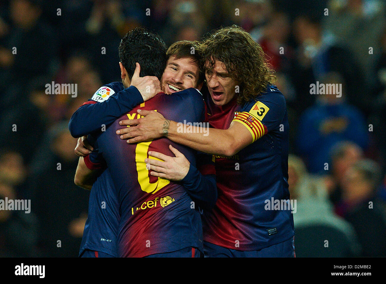 27.01.2013. Mou Camp, Barcelona, Spain.  Lionel Messi (FC Barcelona) celebrates with his teammates Xavi Hernandez (FC Barcelona) and Carles Puyol (FC Barcelona), during the  La Liga soccer match between FC Barcelona and CA Osasuna, at the Camp Nou stadium in Barcelona, Spain Stock Photo