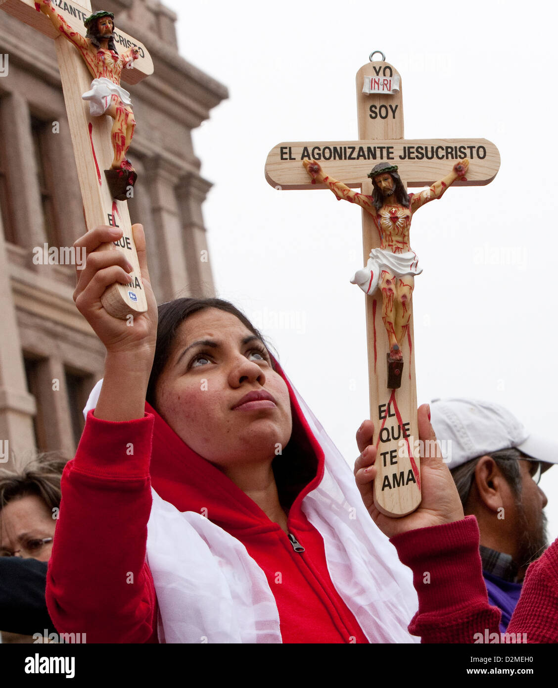 Anti-abortion, pro-life rally at Texas Capitol includes Christian religious attendees. Jesus Christ on cross artifact Stock Photo