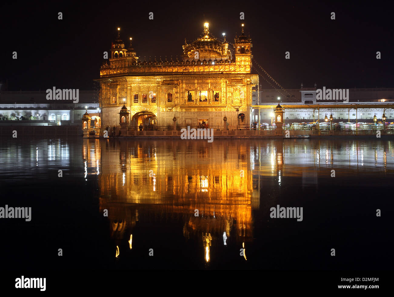 General view of the The Harmandir Sahib also Darbar Sahib, or Golden Temple pictured at night in Amritsar, Punjab, India Stock Photo