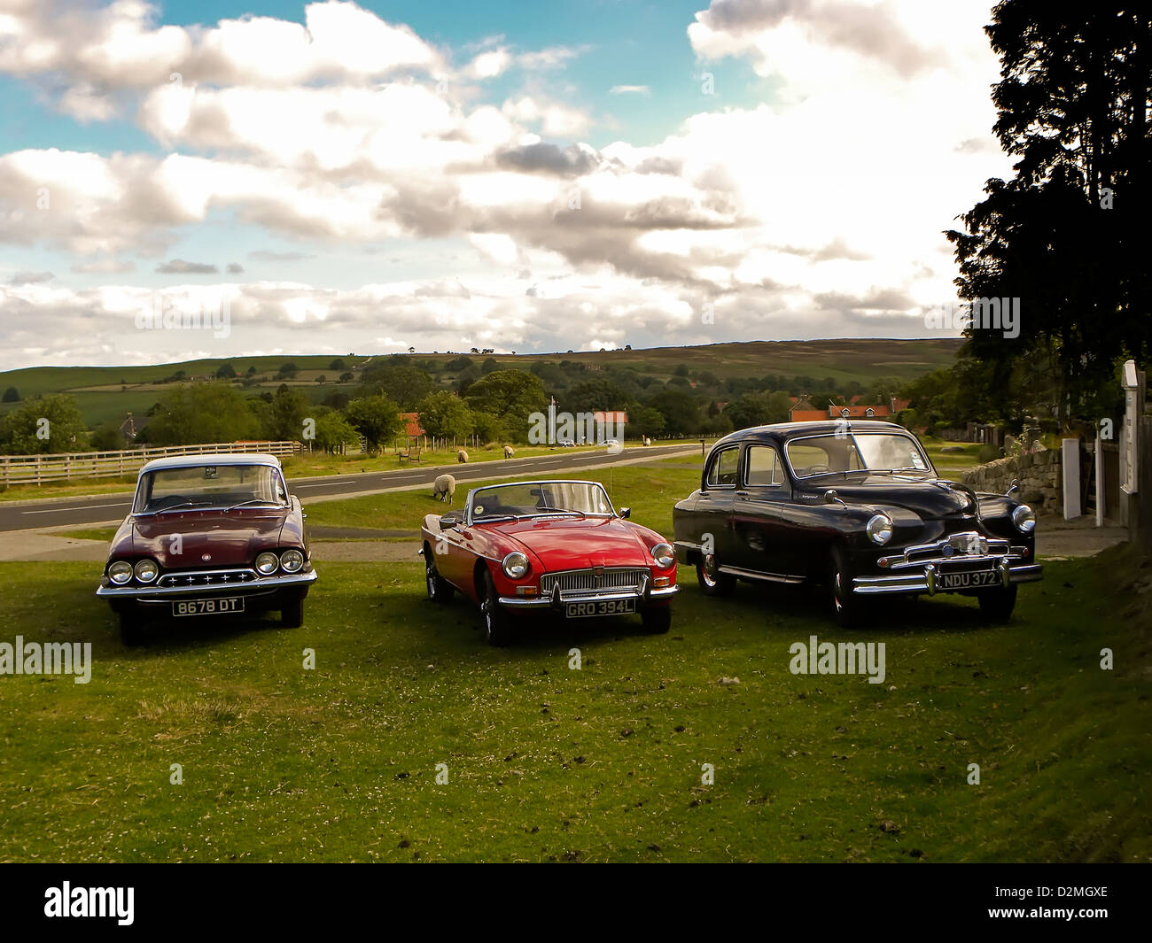 from left  Ford Consul, MG and Vanguard, classic cars parked on the common in Goathland, North Yorkshire. Stock Photo