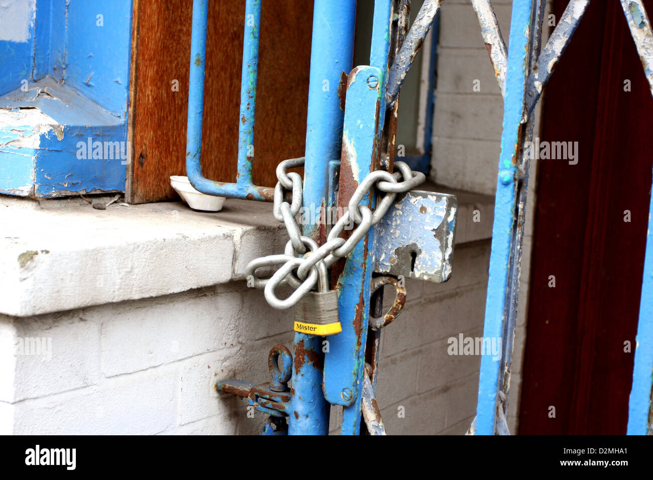 Chained security gate with a padlock Stock Photo