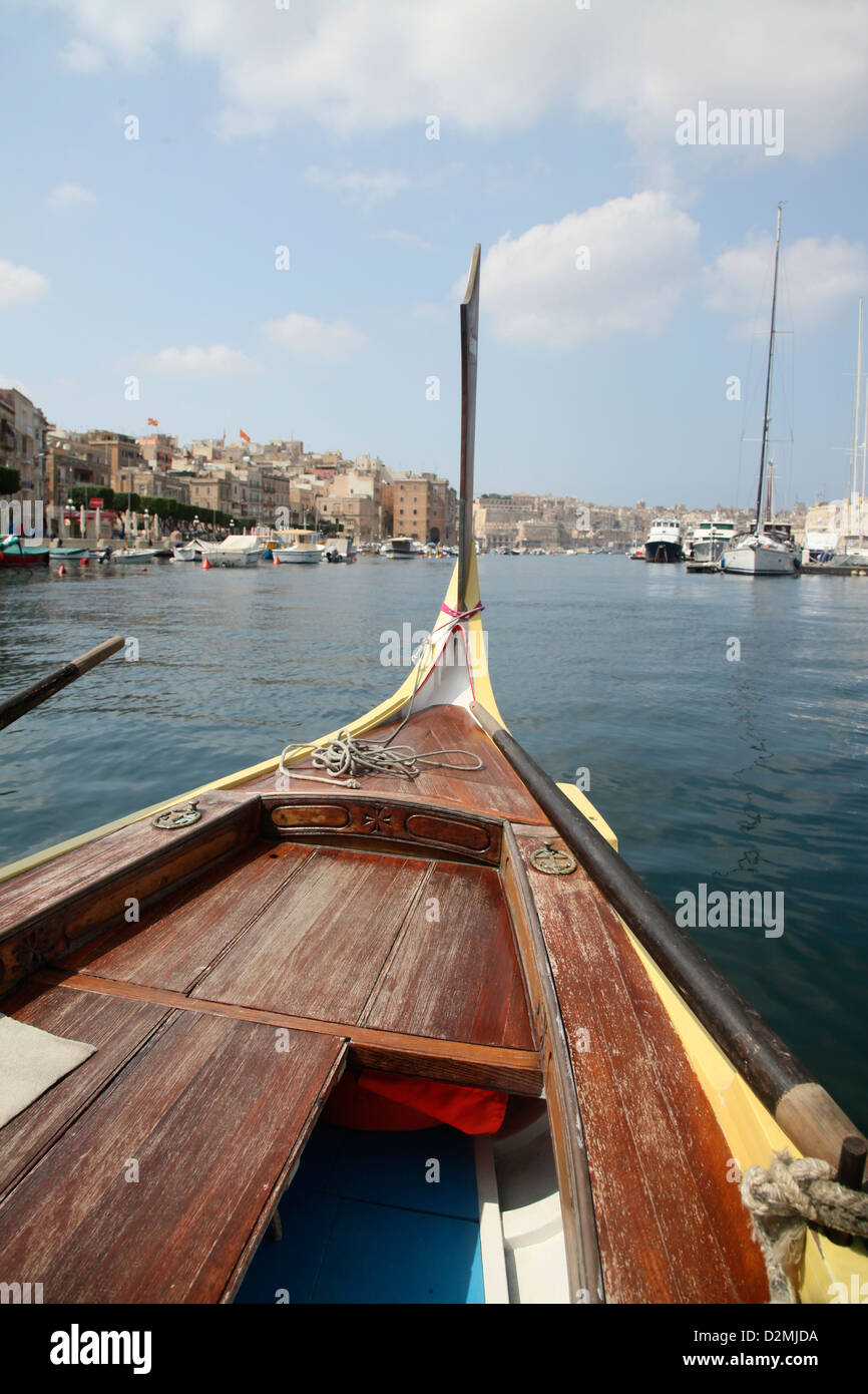 The Maltese Dghajsa is the equivalent of the Venician Gondola. They are water taxis and operate around Grand Harbour Stock Photo