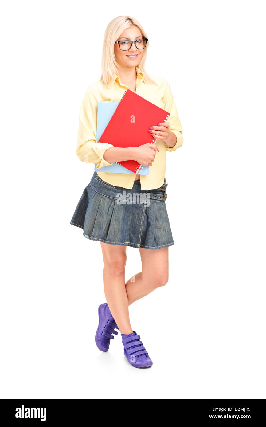 Full length portrait of a female student holding books isolated on ...