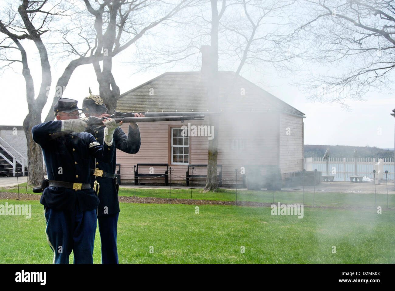 Soldiers firing muskets at Fort Mackinac, Mackinac Island,  Lake Huron, Michigan, USA Stock Photo